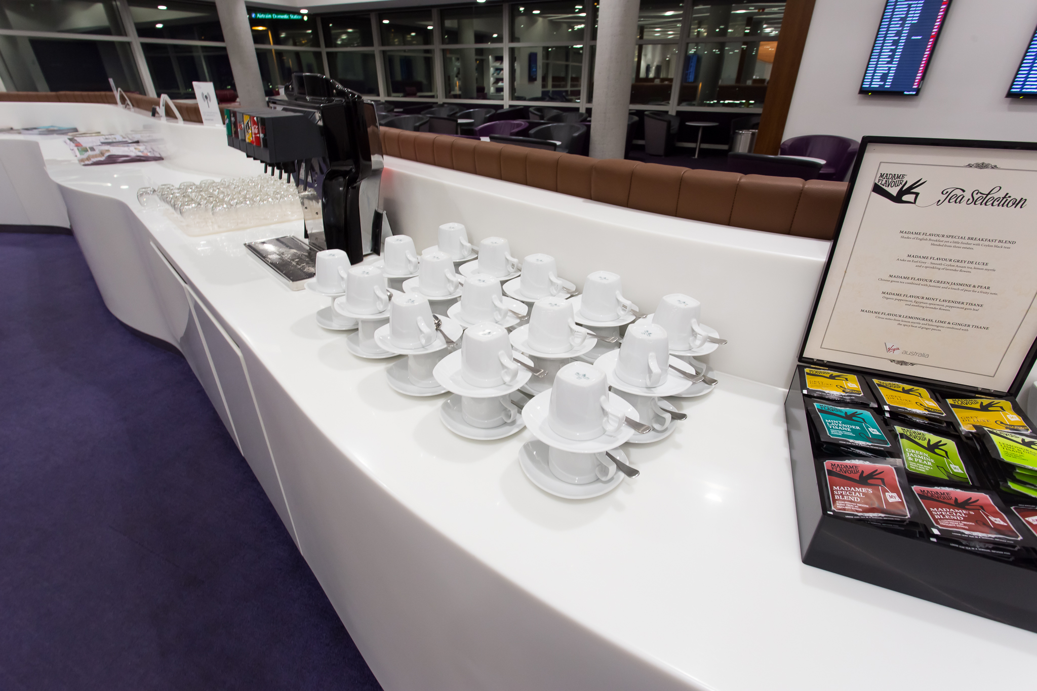 a group of white cups on a counter